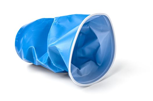 crumpled blue plastic cup, insulated on a white background