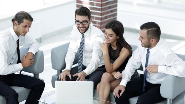 employees sitting in the lobby of the office.office life