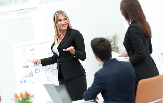business woman pointing a pointer on a flipchart.photo with copy space