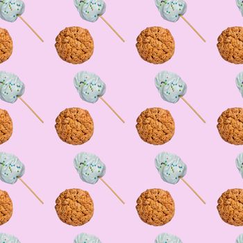 Seamless pattern of oatmeal cookies and sweets on a stick on a pink background.