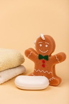 Towel soap and washcloth in the form of a cheerful cookie for comfortable washing of the child. Child care and child hygiene.