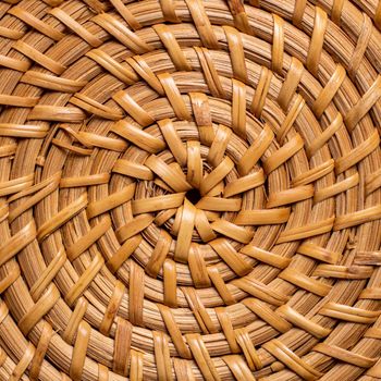 wicker circular basket pattern close-up. handmade
