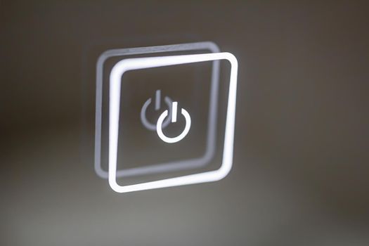 luminous touch button close-up. turn on off. copy space