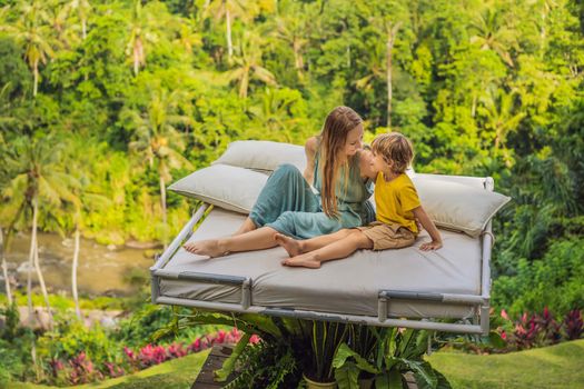 Mother and son over the jungle. Close to nature.