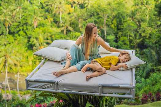 Mother and son over the jungle. Close to nature.