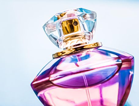 Perfume bottle on glossy background, sweet floral scent, glamour fragrance and eau de parfum as holiday gift and luxury beauty cosmetics brand design.