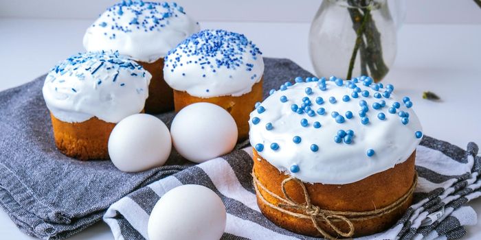 Happy Day Bright Easter. Orthodox Easter holiday. Traditional food. Creative stylish trend Homemade easter cake and eggs. Selective focus. Kulich Festive easter background Minimalism