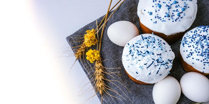 Happy Day Bright Easter. Orthodox Easter holiday. Traditional food. Creative stylish trend Homemade easter cake and eggs. Selective focus. Kulich Festive easter background Minimalism