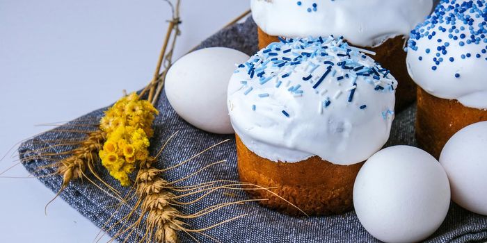 Happy Day Bright Easter. Orthodox Easter holiday. Traditional food. Creative stylish trend Homemade easter cake and eggs. Selective focus. Kulich Festive easter background Minimalism