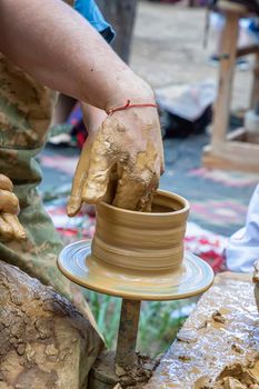 A master of pottery making a jug. Close up