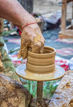 A master of pottery making a jug. Close up