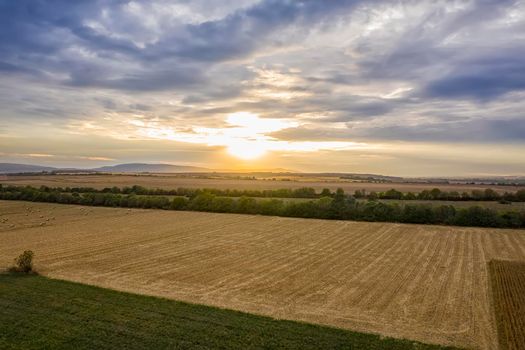 Aerial view from drone to agriculture field at sunset.