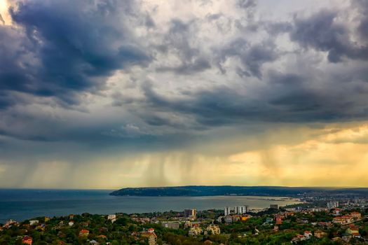 exciting stormy clouds and rain over the sea
