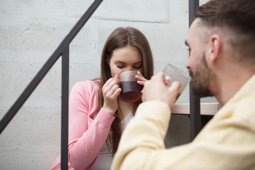 Lovely couple drinking tea at home together