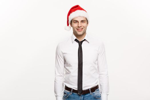 Christmas Concept - Handsome happy Business man wear santa hat posing on white isolated background.