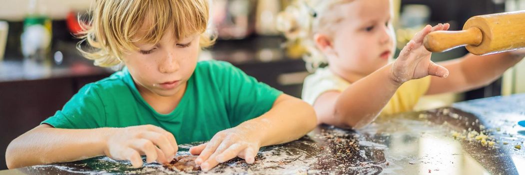 Two children a boy and a girl make cookies from dough. BANNER, LONG FORMAT