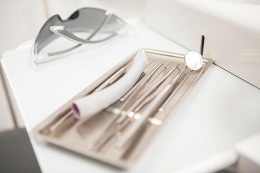 Close up of dental tools at the clinic, sterile medical equipment