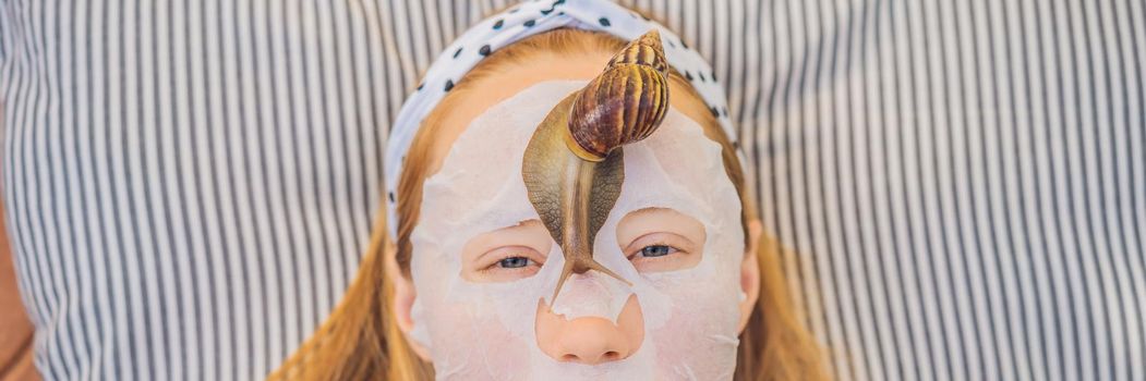 Young woman makes a face mask with snail mucus. Snail crawling on a face mask. BANNER, LONG FORMAT