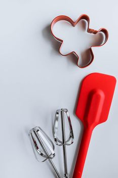 Baking supplies on white background. Spatula, mixer whisks, cookie cutter on white background