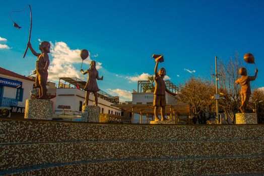 MARMARIS, MUGLA, TURKEY: Fountain with sculptures of Children in Marmaris. Statues of children playing.
