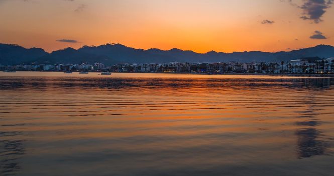 MARMARIS, MUGLA, TURKEY: Beautiful landscape with a view of the sea and the town of Marmaris at sunset.