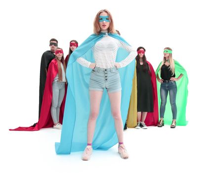 in full growth. girl leader in superhero Cape standing in front of super team. photo with copy space
