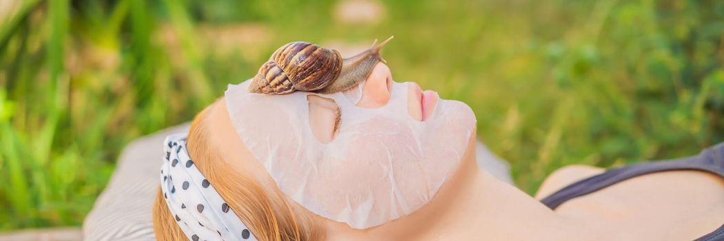 Young woman makes a face mask with snail mucus. Snail crawling on a face mask. BANNER, LONG FORMAT