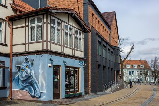 Zelenogradsk, Kaliningrad region, Russia - april 04 2022: An old European house with a large drawing with a blue cat on the wall.