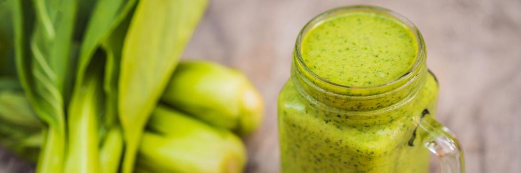 Ginger green apple smoothie on concrete background. It can be used as a background. BANNER, LONG FORMAT