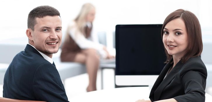 members of the business team sitting at Desk and looking at camera. photo with copy space.