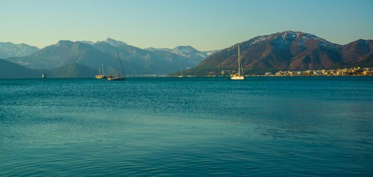 MARMARIS, MUGLA, TURKEY: View from the promenade in Marmaris to the landscape of the snow-capped mountains in winter.