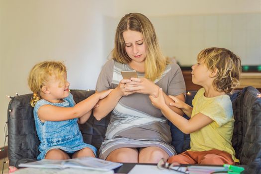 Mom with a smartphone. Digital addiction Children want to spend time with mom, but can not.