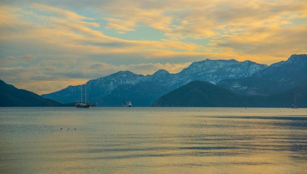 MARMARIS, MUGLA, TURKEY: View from Marmaris beach to the sea and mountains in the snow in winter.