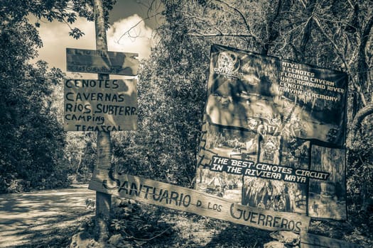Muyil Mexico 04. February 2022 Old black and white picture Information entrance walking trails and welcome sing board with arrow to Santuario de los guerreros in Puerto Aventuras Quintana Roo Mexico.