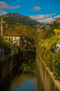 MARMARIS, MUGLA, TURKEY: Canal with water on the street of the city of Marmaris on a sunny day.