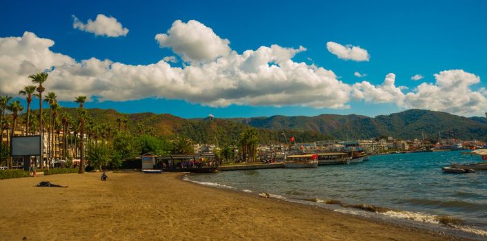 MARMARIS, MUGLA, TURKEY: Beautiful landscape with views of the beach, the Mediterranean sea and the mountains on a sunny day in the Turkish city of Marmaris.