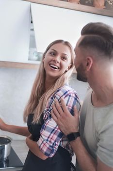 close up. happy young couple preparing dinner together