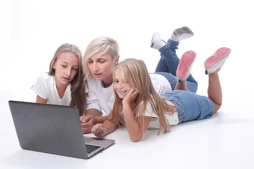 mom and daughters watching their favorite video on a laptop. people and technology