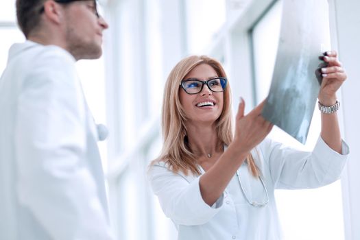 close up. happy doctors looking at patient's x-ray . the concept of health