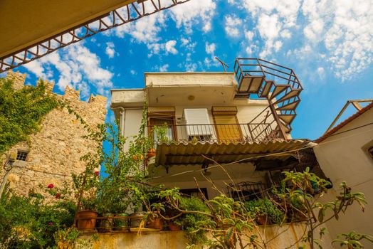 MARMARIS, MUGLA, TURKEY: Beautiful Streets of old Marmaris. Narrow streets with stairs among the houses with white brick, green plants and flowers in the old town of resort of in Turkey