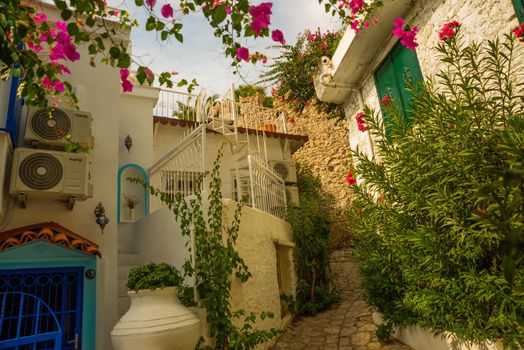 MARMARIS, MUGLA, TURKEY: Beautiful Streets of old Marmaris. Narrow streets with stairs among the houses with white brick, green plants and flowers in the old town of resort of in Turkey