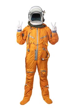 Astronaut wearing orange spacesuit and helmet showing hands with victory sign gestures isolated on white background. Unrecognizable cosmonaut with hands showing victory sign isolated on white background.