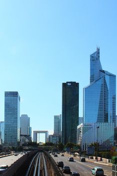 Paris, France - August 26, 2019: Day multi-lane road with skyscrapers of the La Defense.