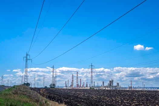 Rows of electrical towers and power lines. Horizontal view