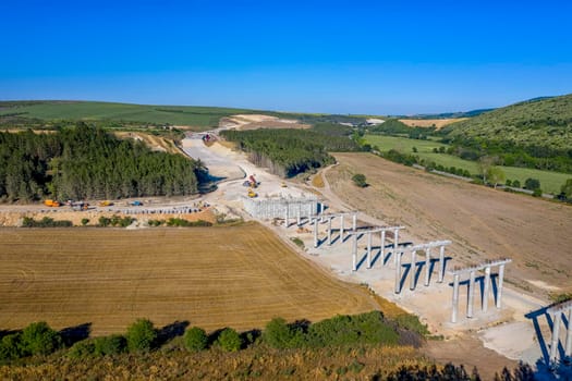 Concrete new bridge supports. Construction of a road bridge.