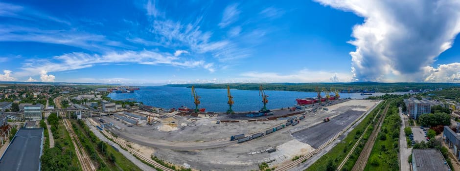 Amazing Aerial panorama from the drone to cargo port and a large ship loading grain for export in the harbor. Water transport