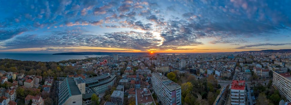 Amazing aerial panoramic view of sunset over the city Varna, Bulgaria. 