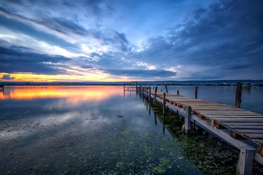 amazing long exposure sea sunset at the wooden jetty