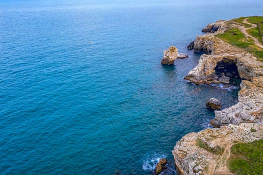 Aerial view from drone of coast with stone arch cliffs near Tyulenovo village, Black Sea, Bulgaria