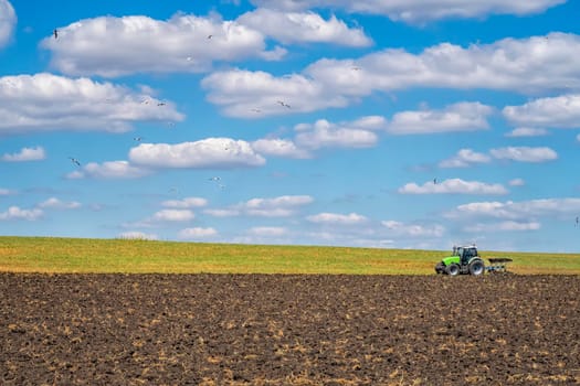 The tractor prepare field for cultivation. Agriculture and agronomy concept. 